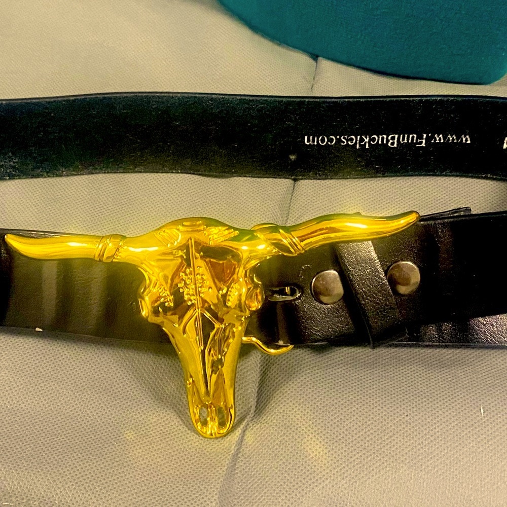 Metal Bull buckle on leather belt